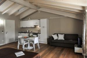 a living room with a couch and a table at Belvivere Suites in Sona