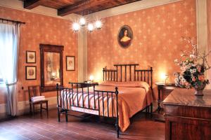 a bedroom with a bed in a room at Castello Di Petroia Dimora d'Epoca in Gubbio +45 photos