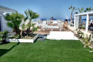 a woman walking on the deck of a cruise ship at Hotel Marzia con Piscina in Riccione +95 photos