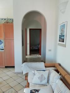 Postel nebo postele na pokoji v ubytování Tana delle Sirene Cilento Coast Acciaroli Sea Pollica