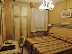 Postel nebo postele na pokoji v ubytování Hotel Falier