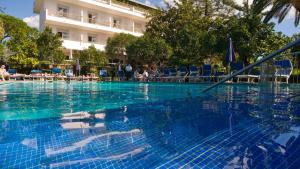 a swimming pool with a reflection of a person in the water at Hotel Alpha in Sant'Agnello