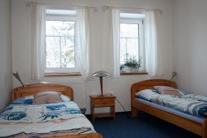 מיטה או מיטות בחדר ב-Apartmány Doma