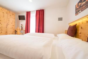 Voodi või voodid majutusasutuse Hotel Alpenrast toas