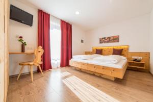 Voodi või voodid majutusasutuse Hotel Alpenrast toas