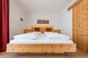 Voodi või voodid majutusasutuse Hotel Alpenrast toas
