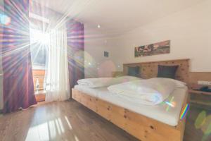 Voodi või voodid majutusasutuse Hotel Alpenrast toas