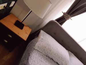 a living room with a couch and a table and a window at Apto Valentina Salou in Salou