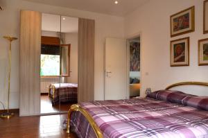 a bedroom with a bed in a room at Casa di Alberta in Rome +22 photos