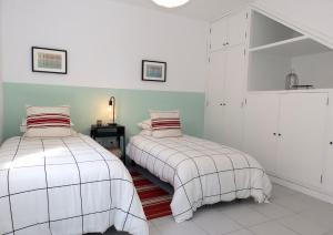 A bed or beds in a room at Apartamentos Medano - Duplex Sea Views