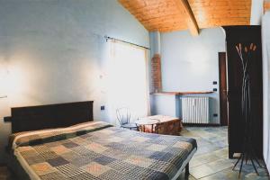 A bed or beds in a room at Agriturismo Fiori di Zucca