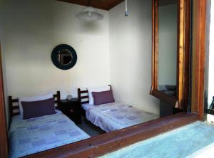 Cama o camas de una habitación en MARIAS COZY HOUSE