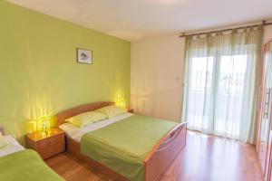 Cama o camas de una habitación en Apartments Branka