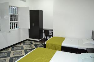Cama o camas de una habitación en Hotel la Colina