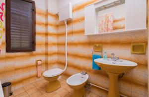 a bathroom with a toilet and a sink at Apartment Villa Olga in Poreč +41 photos