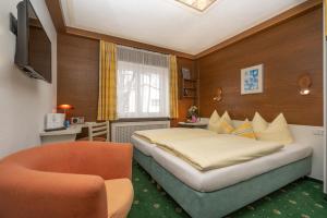 Säng eller sängar i ett rum på Hotel Sonnenspitz ***