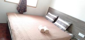 Ein Bett oder Betten in einem Zimmer der Unterkunft Alor Setar homestay