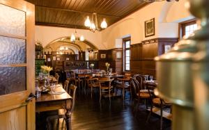 a restaurant with tables and chairs in a room at Weinhaus Schultes in Limburg an der Lahn