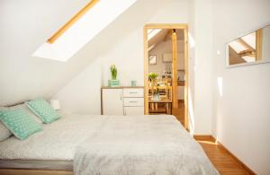Posteľ alebo postele v izbe v ubytovaní Apartament w Rynku + 7 fotografií