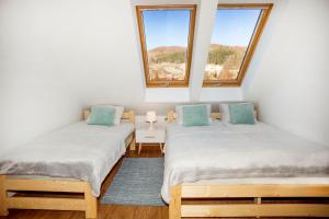 Posteľ alebo postele v izbe v ubytovaní Apartament w Rynku