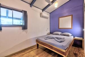 Katil atau katil-katil dalam bilik di Playa 506 Beachfront Hostel