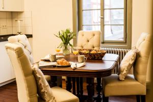 a dining room with a table and two chairs at Weinhaus Schultes in Limburg an der Lahn