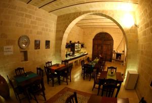 an inside view of a restaurant with tables and chairs at Alla Selva Gravina in Gravina in Puglia
