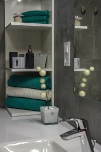 Posteľ alebo postele v izbe v ubytovaní Grey Suites Pécs