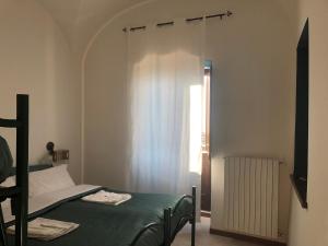 Voodi või voodid majutusasutuse Ostello-Albergo dagli Elfi toas