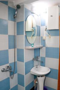 a bathroom with a sink and a mirror at Guest House Dorkos in Dorkovo +38 photos