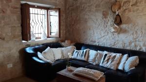 A seating area at Trullo la perla di pietra