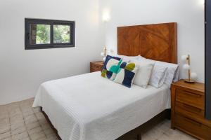 Ένα ή περισσότερα κρεβάτια σε δωμάτιο στο Villa Dorado B