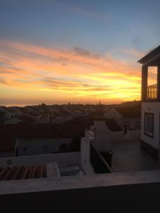 a view of a sunset from the roof of a building at Vivenda Garcia Bed and Breakfast in Relva