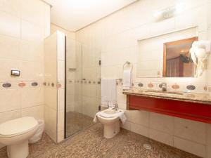 Um banheiro em Real Castilha Hotel