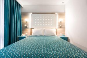 Una cama o camas en una habitación de Hotel Casa Blanca