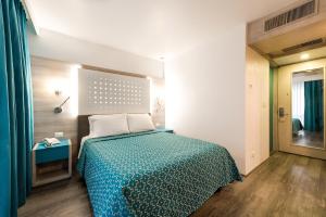 Una cama o camas en una habitación de Hotel Casa Blanca