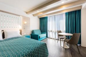 Una cama o camas en una habitación de Hotel Casa Blanca