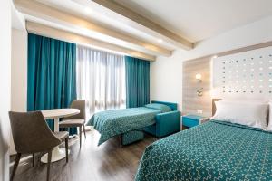 Una cama o camas en una habitación de Hotel Casa Blanca