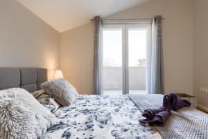 Posteľ alebo postele v izbe v ubytovaní Exclusive Apartments WithLove Zadar