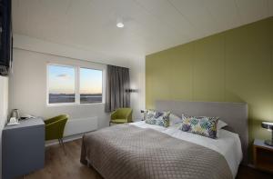 Voodi või voodid majutusasutuse Hotel Klaustur toas
