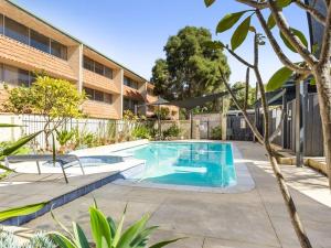 a swimming pool in front of a building at The Parks Rosalie 32 - 1BRM Unit with Parking in Perth