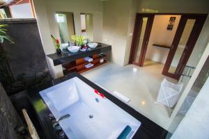 an aerial view of a bathroom with a tub at Amore Villas in Canggu