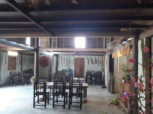 a dining area with chairs and a table in a room at Eco Hills Homestay in Sapa