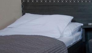 Voodi või voodid majutusasutuse M0 Caffe & Motel toas