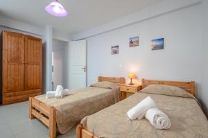 Posteľ alebo postele v izbe v ubytovaní NAXOS HOUSE