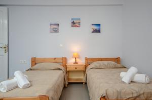 Posteľ alebo postele v izbe v ubytovaní NAXOS HOUSE