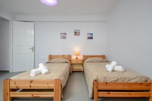 Posteľ alebo postele v izbe v ubytovaní NAXOS HOUSE