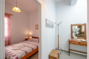Posteľ alebo postele v izbe v ubytovaní NAXOS HOUSE