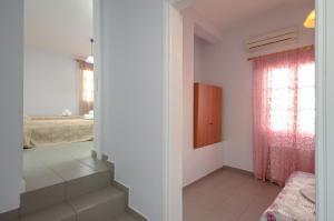 Posteľ alebo postele v izbe v ubytovaní NAXOS HOUSE