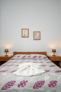 Posteľ alebo postele v izbe v ubytovaní NAXOS HOUSE